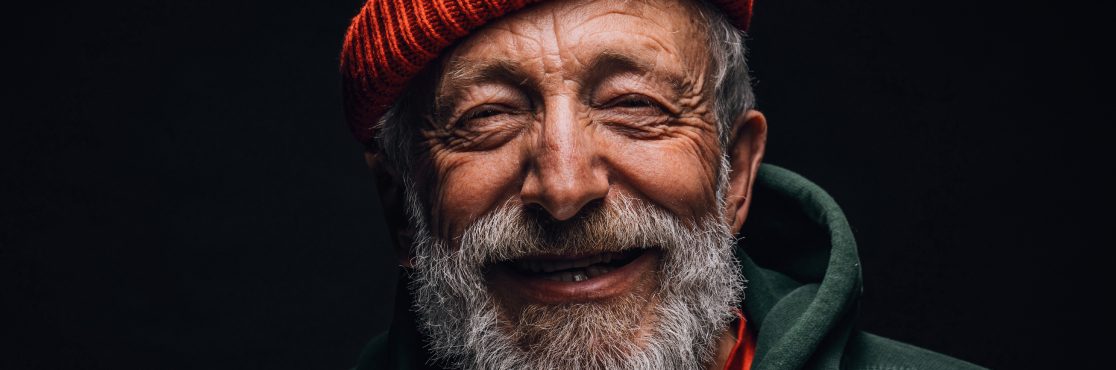 close up of homeless man smiling